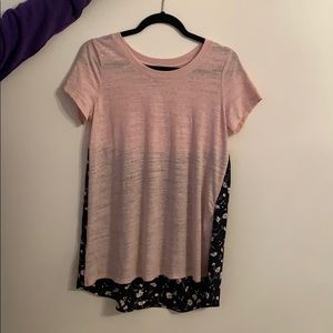 pink shirt with floral design on the back